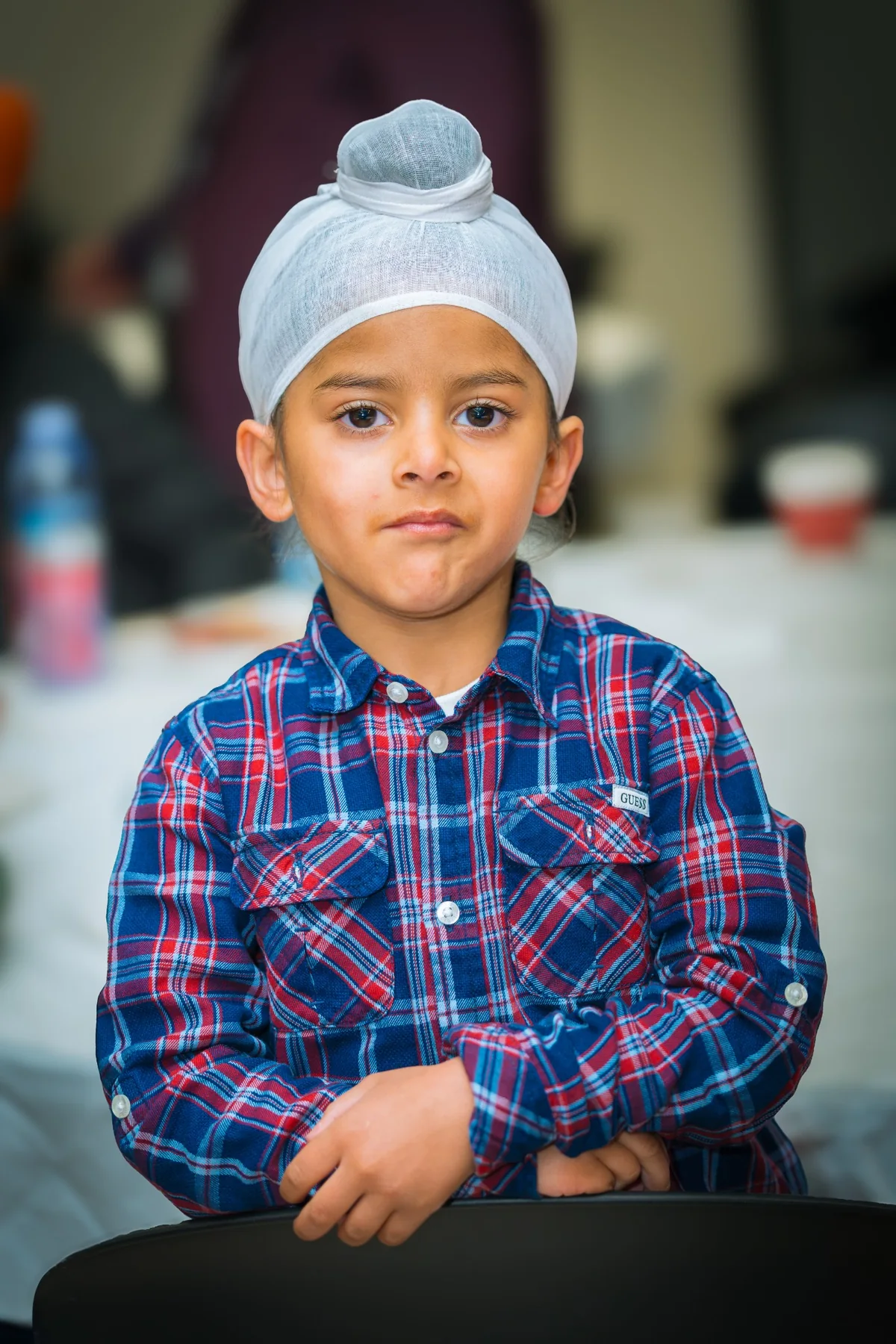 Toddler portrait photographed during an indoor birthday celebration