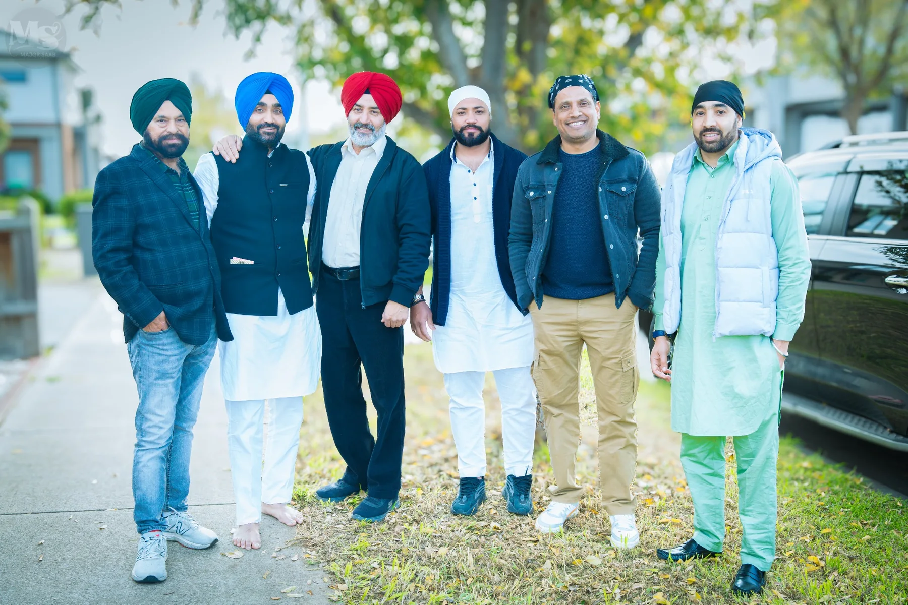 Group portrait of guests at a Punjabi family celebration